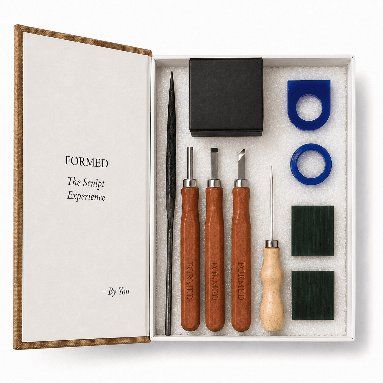 FORMED Sculpting Experience box opened, showing the wax blocks, carving tools and files inside