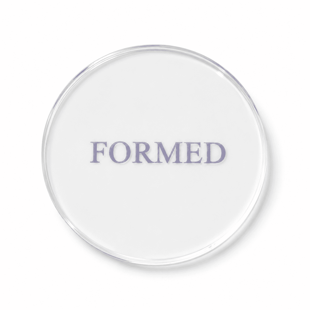 Clear FORMED setting disc used to shape the captured impression